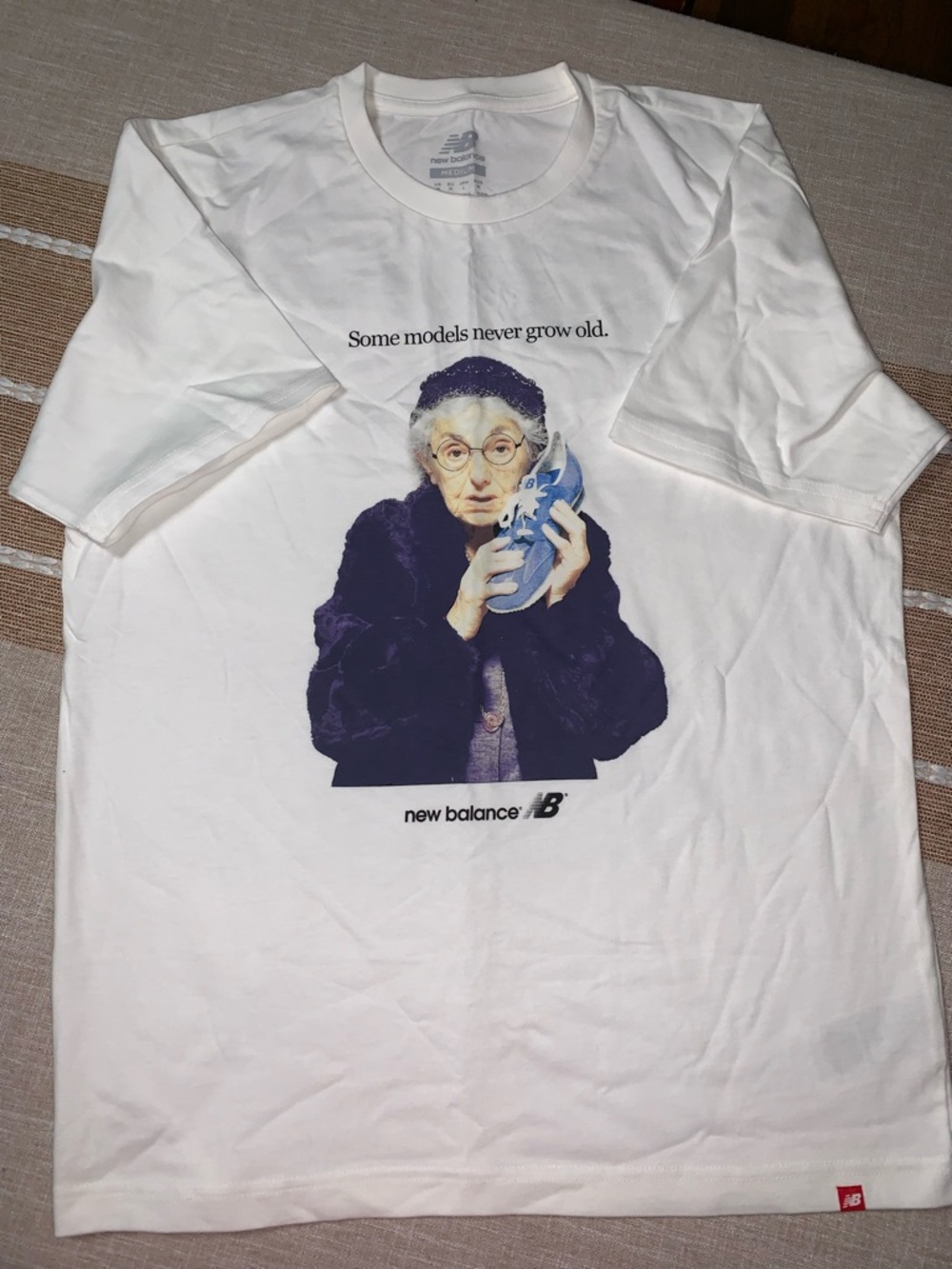 New Balance White Graphic Short Sleeve Tee with Navy and Light Blue Print